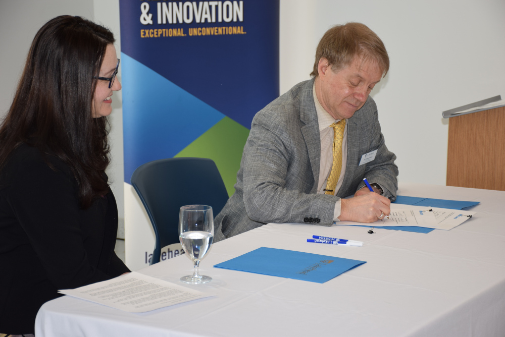 Christine MacDonald, Director of Business Development & Team Lead Ontario, Mitacs, and Dr. Andrew Dean, Vice President of Research & Innovation, Lakehead University and Chair of the CALAREO Consortium.